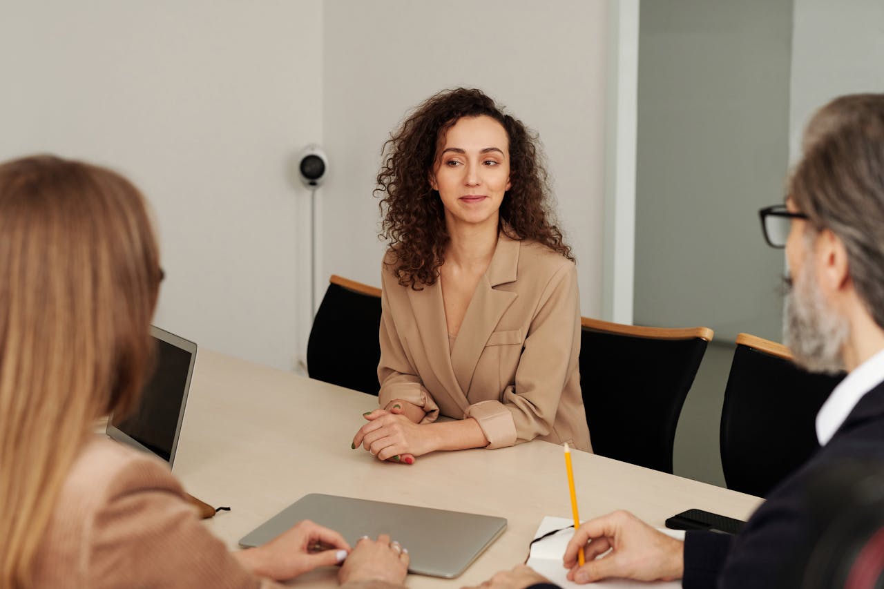 The Art of Drawing Readers In: Your attractive post title goes here Colleagues discuss projects around a conference table in a modern office setting.
